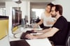 Kolleg:innen der prodot bei der Arbeit am PC