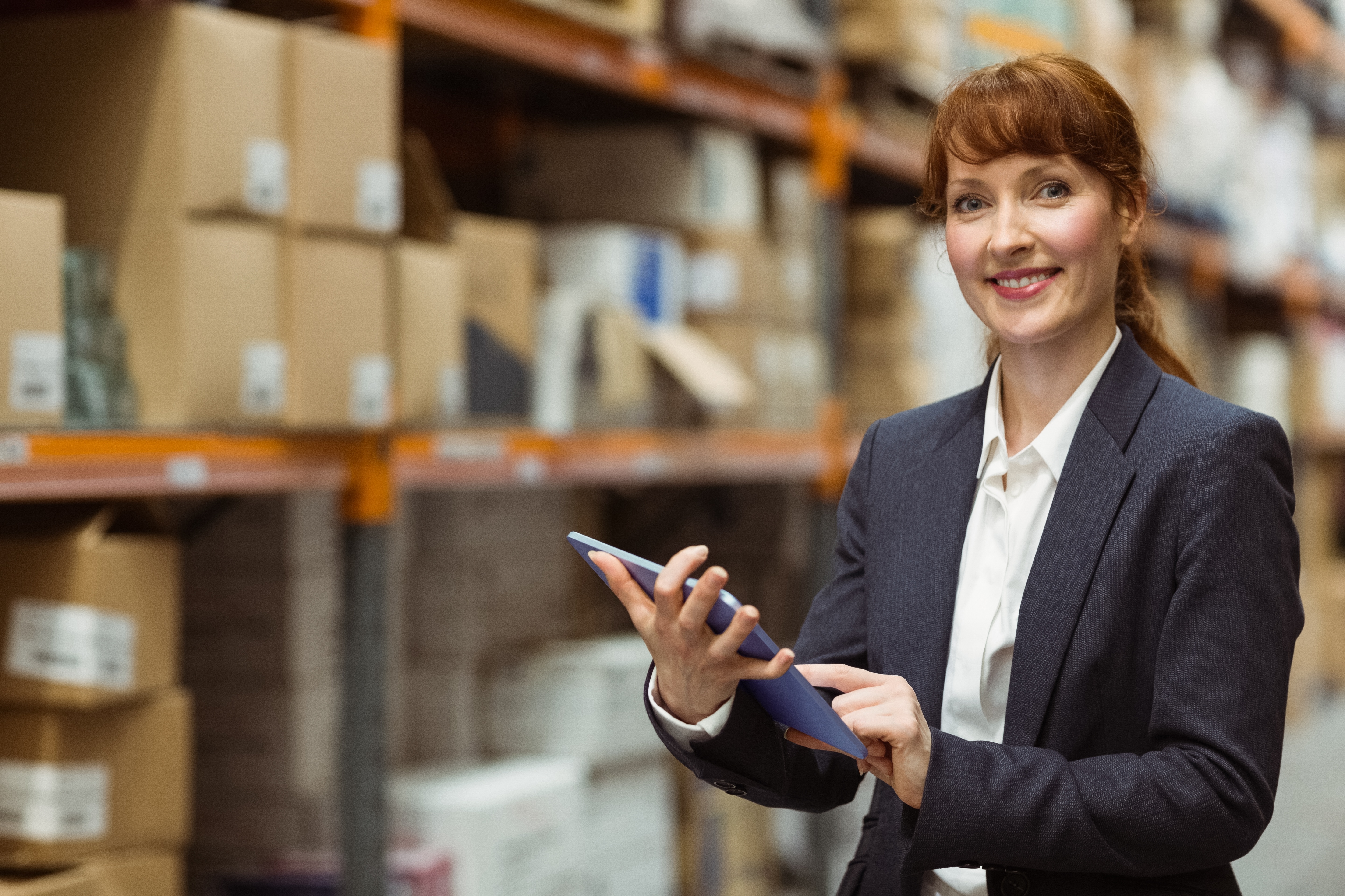 Image of woman with tablet and workflow management.